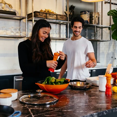 Couple cooking a healthy meal at home
